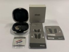 An Oticon Engage BTE Hearing Aid in Beige and White Case.