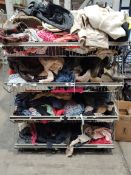 Four baskets of pre-owned clothing to include t-shirts, bags, shoes and more.