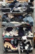 Four baskets of pre-owned clothing to include t-shirts, cardigans and more.