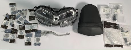 Triumph Motorcycles Related Items- Headlight, Rear Pillion Passenger Seat, R/H Brake Lever and a Sma