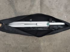 A preowned Expand Flag Stand XL with carry bag. (some damage to bag/ sold as seen)