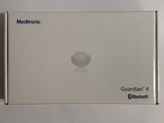 An as new Medtronic Guardian 4 Transmitter Kit (REF: MMT-7840W1, Recharge By Date: 2024-12-07).