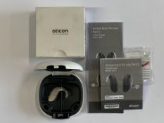 An Oticon Engage BTE Hearing Aid in Beige and White Case.