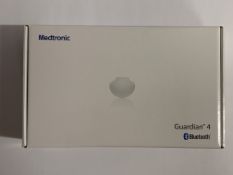 An as new Medtronic Guardian 4 Transmitter Kit (REF: MMT-7840W1, Recharge By Date: 2024-12-08).