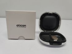 An as new Oticon Engage BTE hearing aid in a Beige and White case.