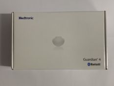 An as new Medtronic Guardian 4 Transmitter Kit (REF: MMT-7840W1, Recharge By Date: 2024-11-09).