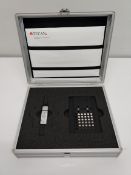 A pre-owned TECAN Multi-Check quality control tool for infinite series readers.