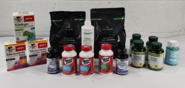 Sixteen assorted supplements and protein powders (expired dates within 6 months).