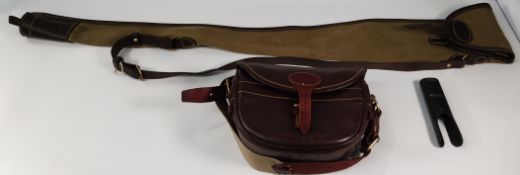 Three pre-owned gun related items; a William Evans canvas and leather gunslip