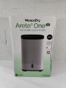 A boxed Meaco Aretne One 20L dehumidifier air purifier.