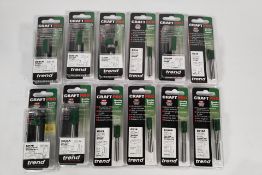 Twelve as new assorted Trend Cutters, various types and sizes.