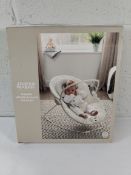 A boxed Mamas and Papas Capella vibrate and sound bouncer.