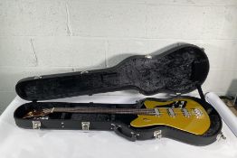 As new Duesenberg Triton Goldtop bass with hard case.