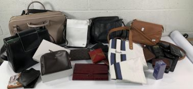 A crate of assorted pre-owned handbags, purses, wallets and related.