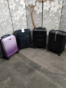 Four assorted pre-owned Samsonite wheeled suitcases.
