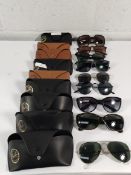 Nine pairs of pre-owned Ray-Ban sunglasses with cases.