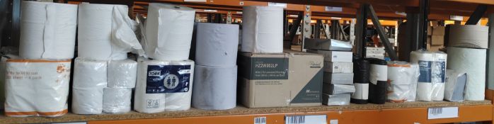 A quantity of assorted cleaning and hygiene related products on one shelf.