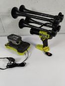 A Ryobi train horn with battrery, charger and remote.