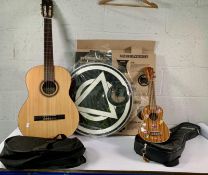 A pre-owned Cordobo acoustic guitar and a Deviser Ukelele with travel bags.