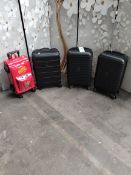 Three pre-owned Desley hard shell wheeled suitcases and a childs Steve McQueen Cars suitcase.