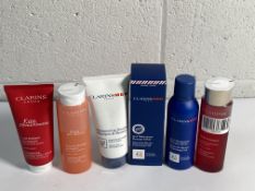 Six Clarins beauty products to include multi intensive essence 200ml, energizing melting body lotion