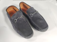 A pre-owned Gucci suede dark blue Horsebit driving loafers, size M 12 GV 44, some marks.