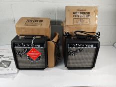 An as new Fender Frontman 10g practice amp and a pre-owned Squier Frontman 10g practice amp.