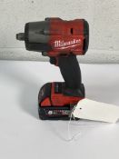 A pre-owned Milwaukee Fuel M18 2 impact wrench FMTIW2F1 with M18 red lithium battery.