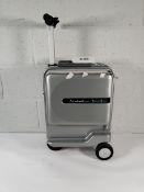 A pre-owned Airwheel Robot ride-on suitcase with battery.