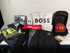 Eighteen items of as new clothing and baseball caps.