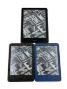 Three pre-owned Amazon Kindles.