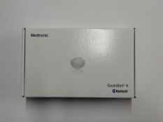 An as new Medtronic Guardian 4 Transmitter Kit (REF: MMT-7840W1, Recharge By Date: 2025-04-07).