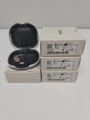 Four as new Oticon Engage BTE hearing aids in beige, in a white case.