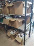 Seven boxes of assorted medical items/equipment on three shelves.
