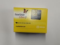 An as new Abbott FreeStyle Libre 2 flash glucose monitoring systems sensor (EXP: 2026-05-31).