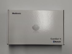 An as new Medtronic Guardian 4 Transmitter Kit (REF: MMT-7840W1, Recharge By Date: 2025-04-22).