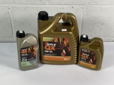 Three bottles of Triple QX 5W-30 Oil (5L, 1L and C3 1L).
