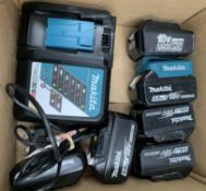 Six pre-owned Makita power tool batteries and 240v charger.