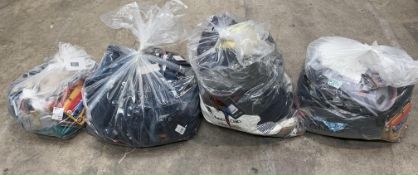 Four bags of as new clothing and related items to include Sketchers, Adidas, Zara and Superdry.