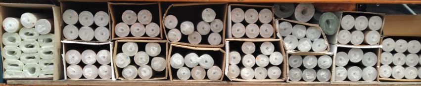 Approximately one hundred rolls of assorted wallpaper.