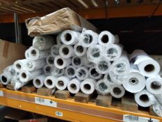 Forty five rolls of assorted white paper.