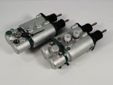 A pair of pre-owned Carlisle Brake Master Booster Cylinders.