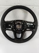 A pre-owned Land Rover steering wheel.