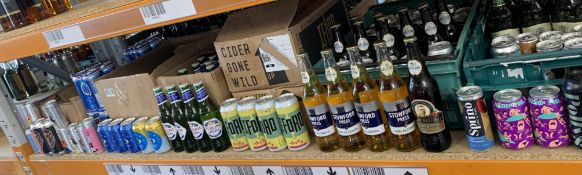 One shelf of assorted cans/bottles of beers/wine/ciders and related.