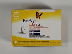 An as new Abbott FreeStyle Libre 2 flash glucose monitoring systems sensor (EXP: 2026-03-31).