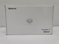 An as new Medtronic Guardian 4 Transmitter Kit (REF: MMT-7840W1, Recharge By Date: 2025-04-22).