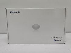 An as new Medtronic Guardian 4 Transmitter Kit (REF: MMT-7840W1, Recharge By Date: 2025-04-22).