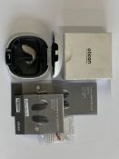 An Oticon Engage BTE Hearing Aid in Beige and White Case.