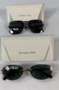 Two pairs of pre-owned Michael Kors sunglasses MK1151 and MK1150 with cases.