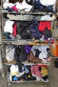 Four baskets of assorted pre-owned clothing and related items.